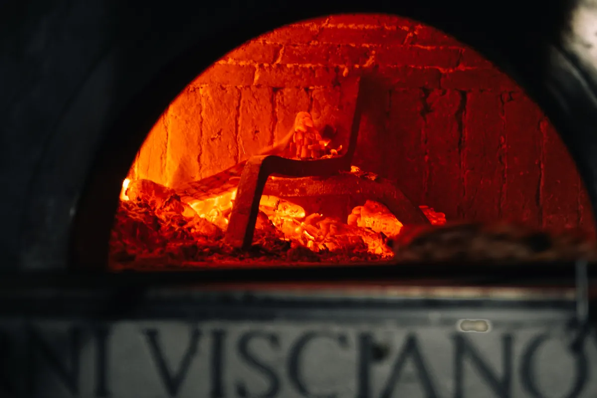 The oven glowing red in the dark