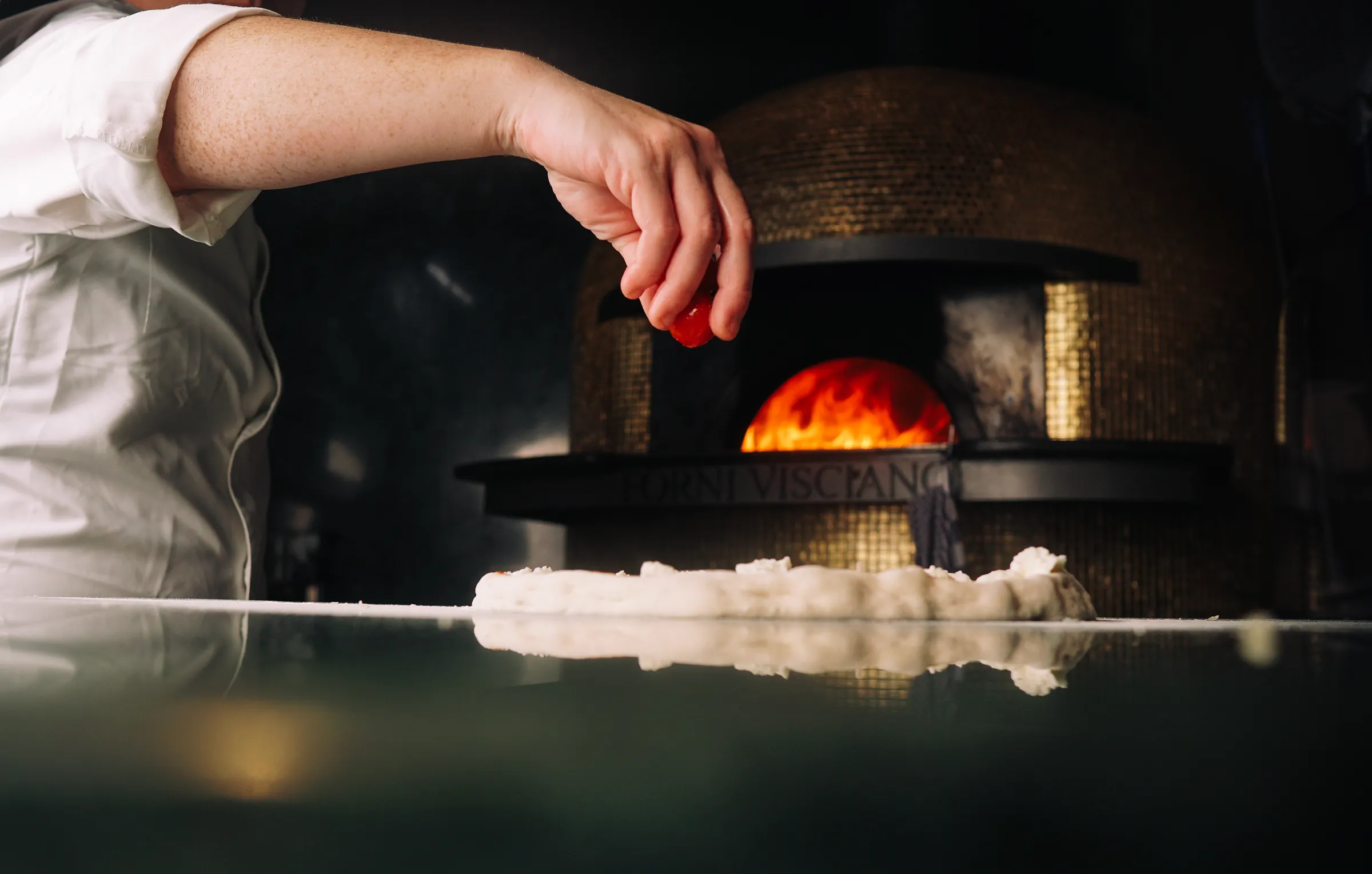 A Di Luca pizzaiolo at the wood-fired oven