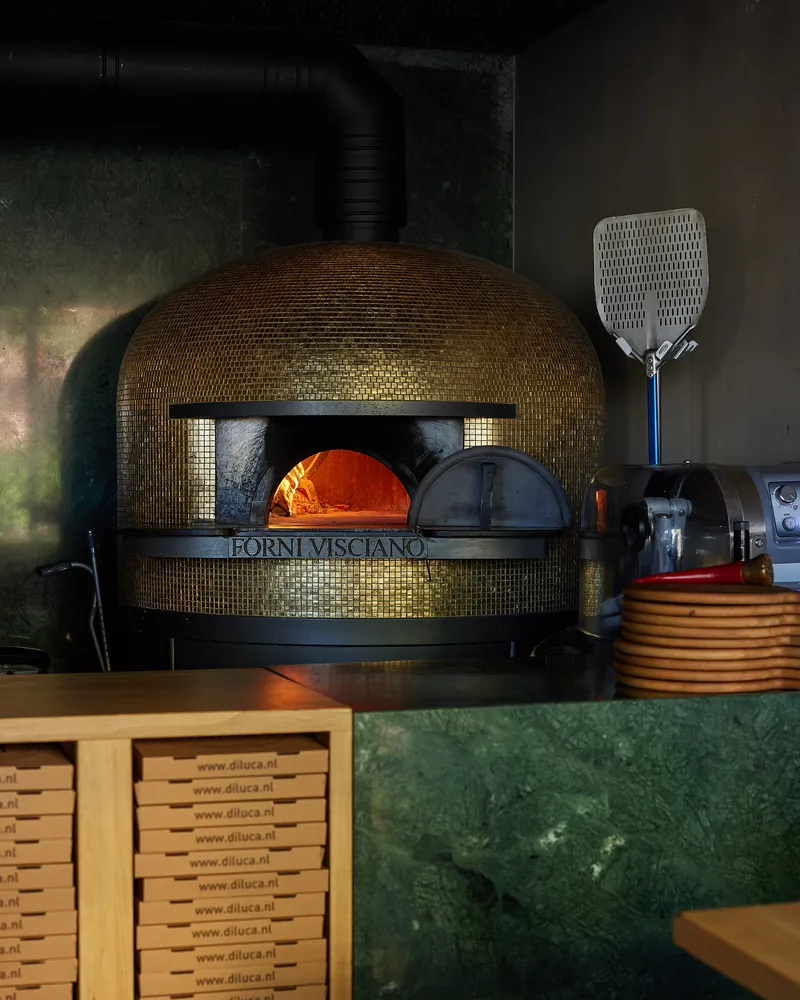 The oven with plates stacked beside it