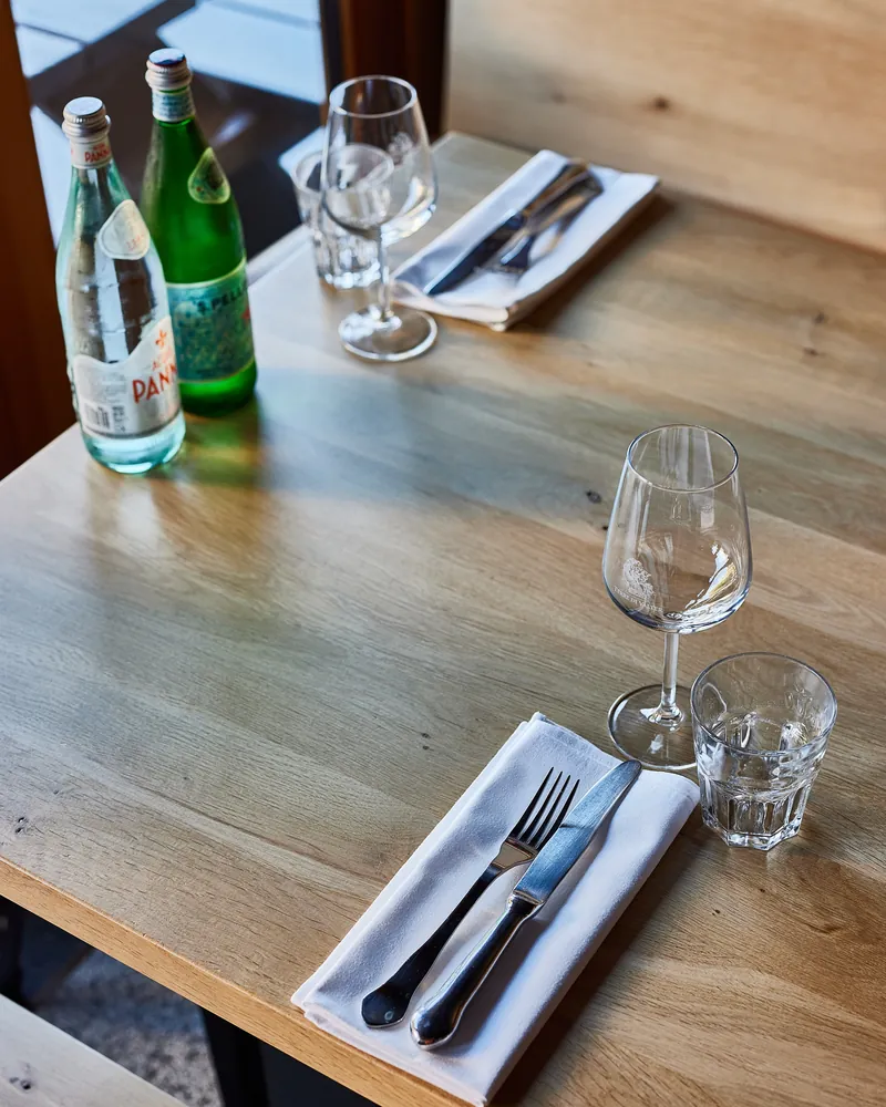 A laid table with water and glasses