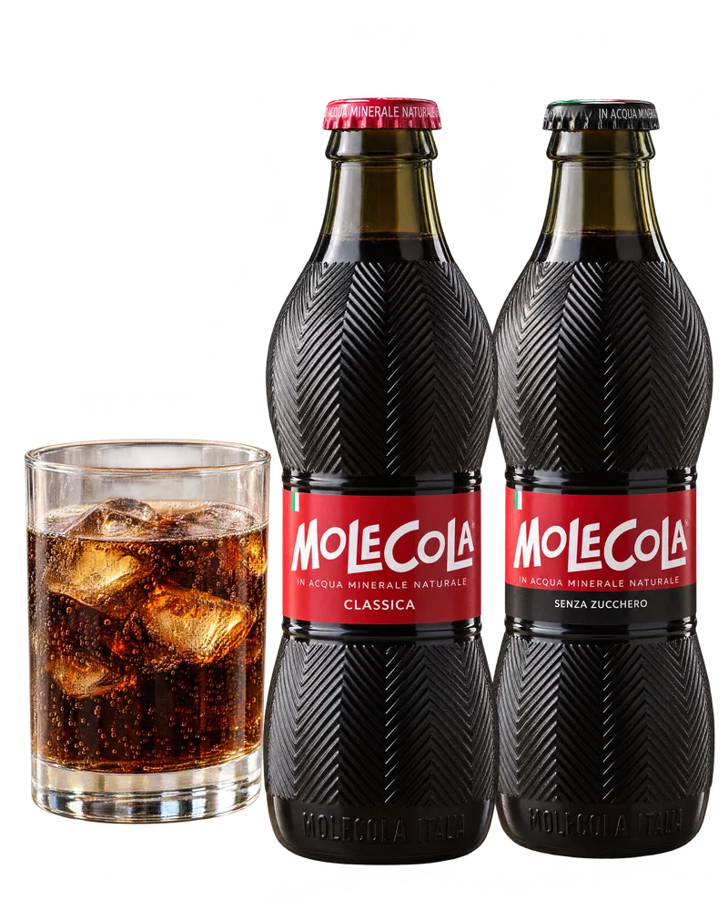 Two bottles of MoleCola beside a glass of cola