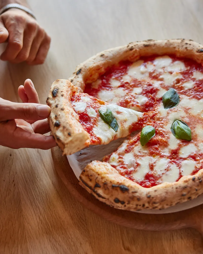 A slice pulled from a Margherita