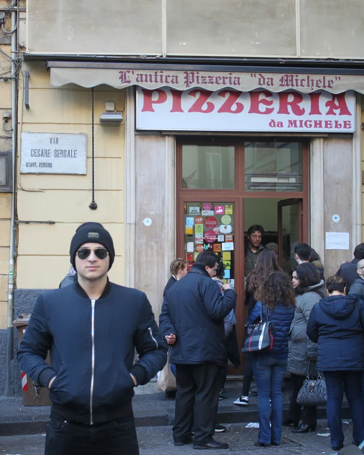 Luca outside L'Antica Pizzeria da Michele in Naples